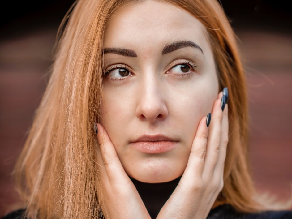 After: Same portrait with AI Portrait Enhancer applied that removed blemishes and corrected lighting.