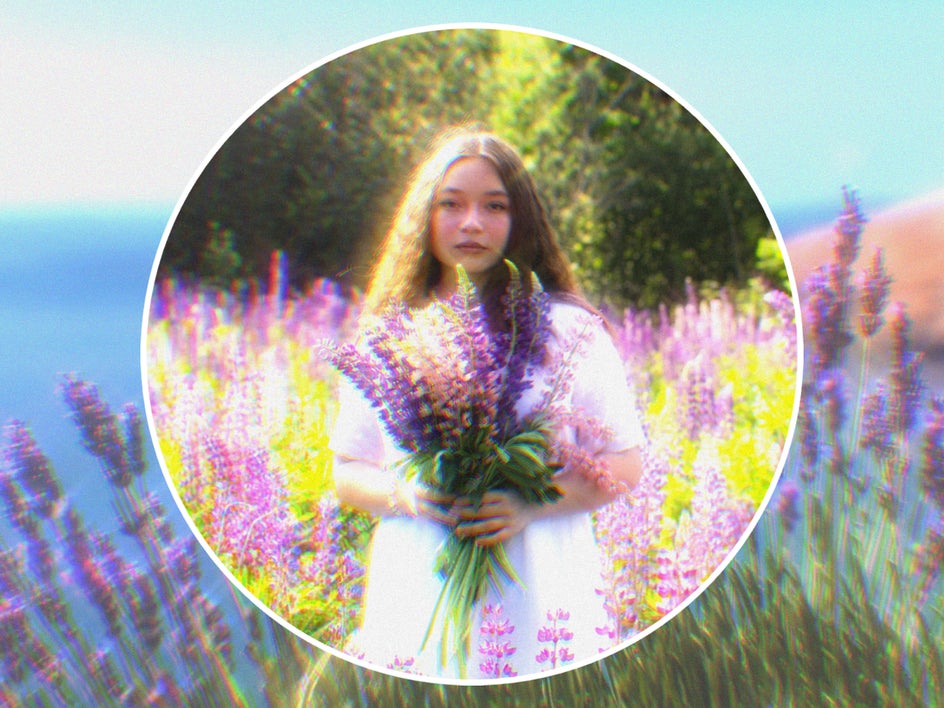 glowy vintage effect applied to female portrait in field of lavender with matching background
