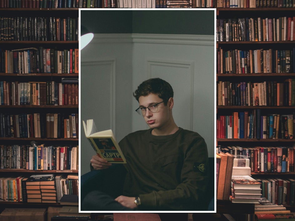 before: man reading with books in background