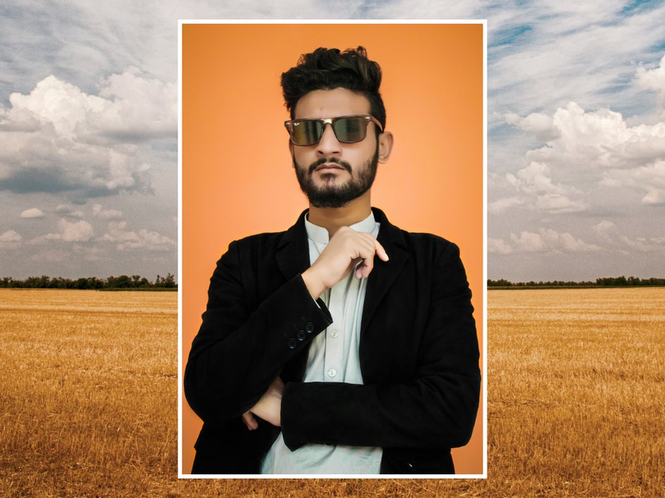 before: portrait of man with sunglasses and suit and picture of field in background