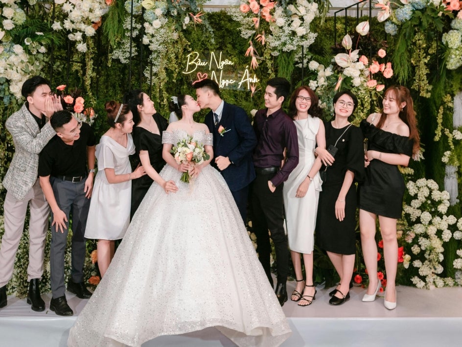 After: same wedding photo with far-right man removed