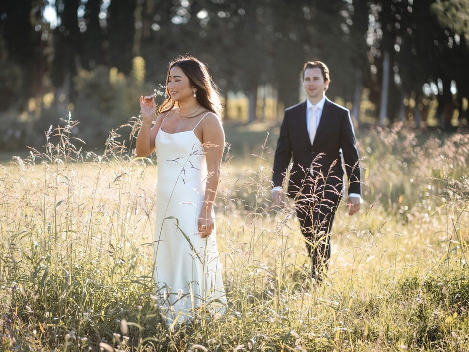 Before: Wedding portrait of woman and man in field of wild grass