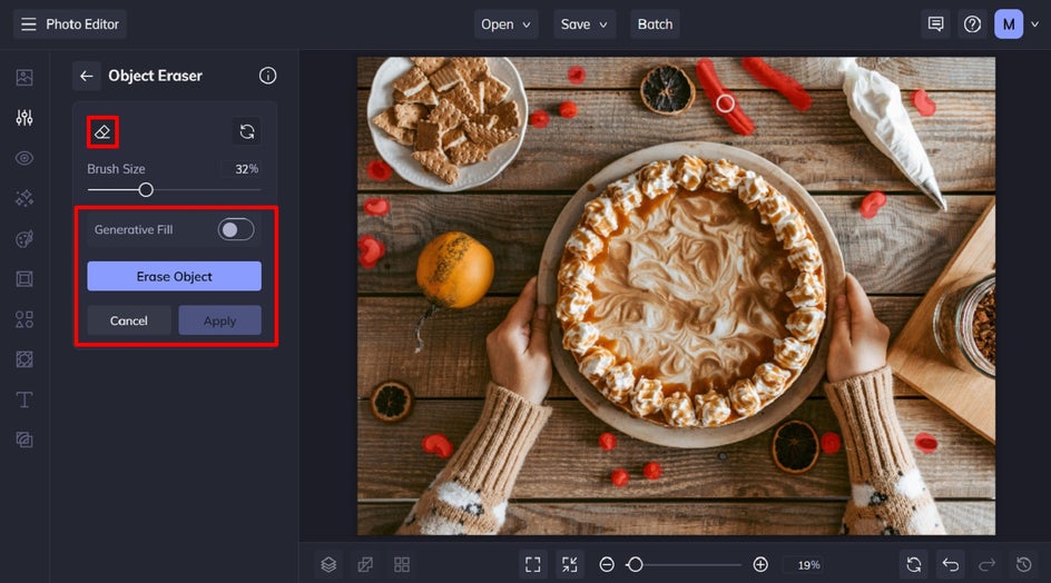 The Object Remover tool in use on a top-down image of a pie surrounded by baking clutter. Red overlay highlights selected items like utensils and eggshells for removal.