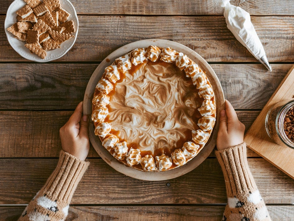 After: The same pie photo with surrounding clutter removed. Only the pie remains on a clean wooden surface, creating a minimalist, professionally styled look.