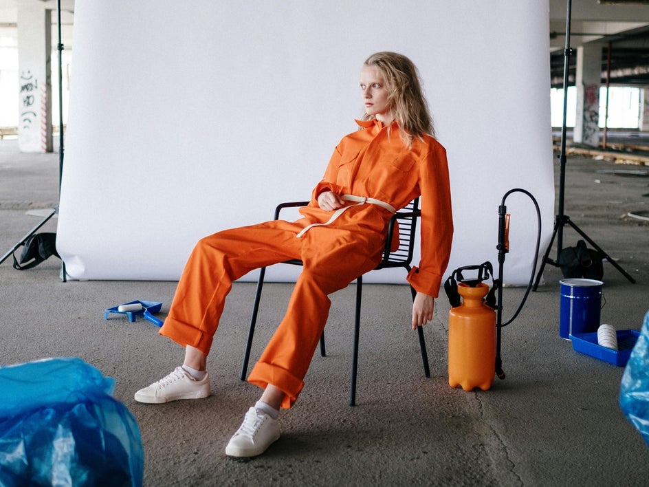 Before: Fashion photo cluttered by random objects and props, distracting from overall aesthetic.