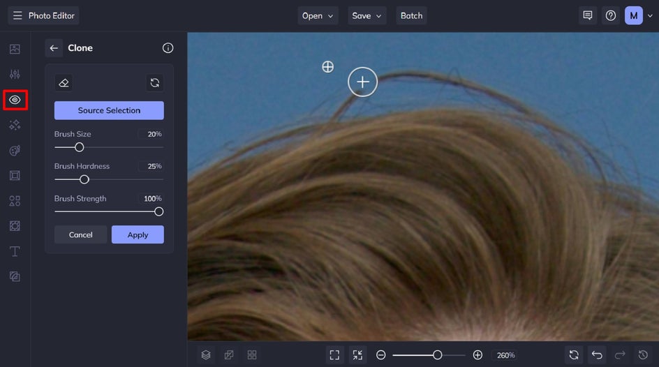 Cleaning up flyaway hairs in a headshot using BeFunky’s Clone Tool