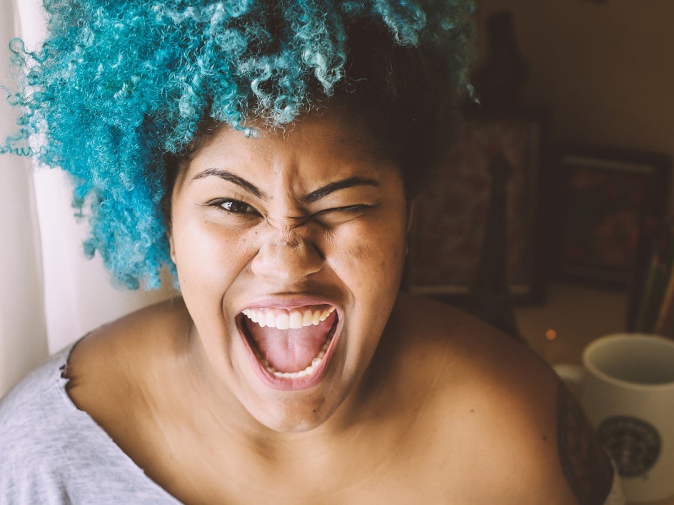 Before: Female portrait with blue hair making silly face with slightly yellowed teeth.