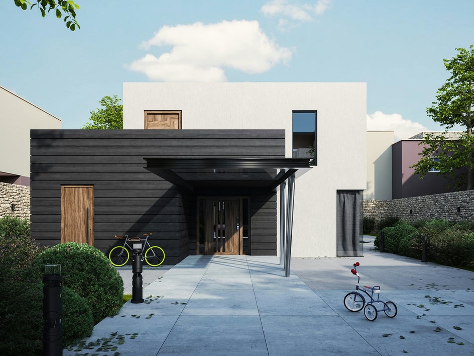 Before: A photo of a home’s front yard with two bicycles parked in the foreground.